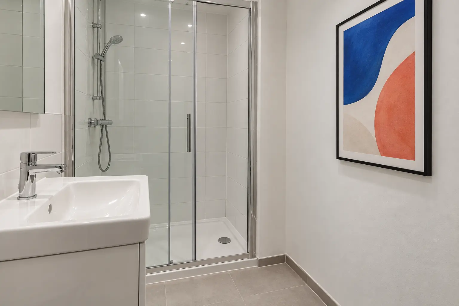 Hang one colorful print on a dry bathroom wall